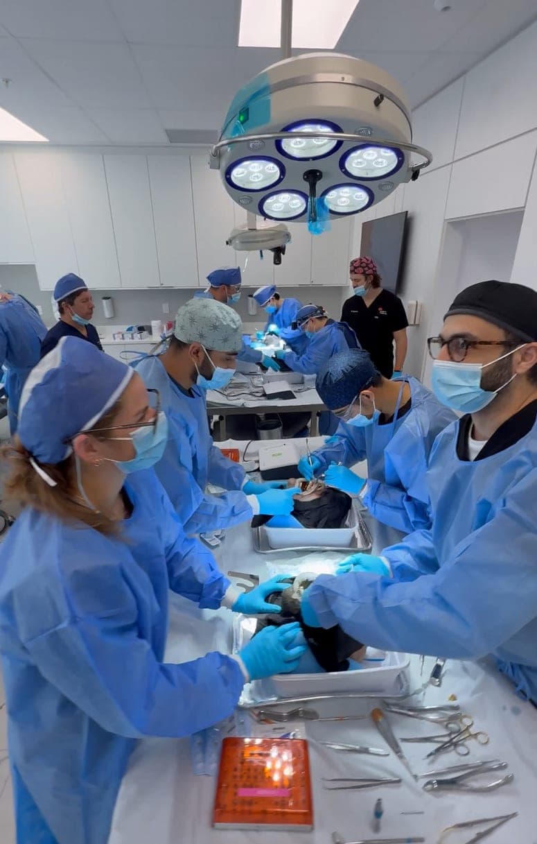 The surgical team at work on an All-on-X case, with Vertex in the room
